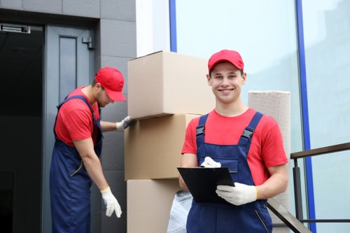 Man and van team sorting recyclable household items in Tooting