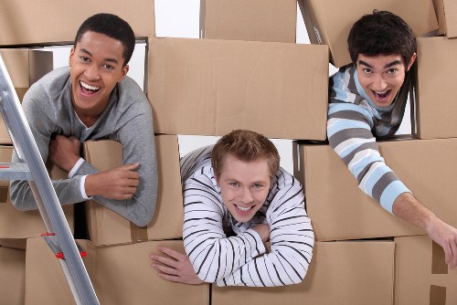 Same day removals crew preparing items for transport in South West London
