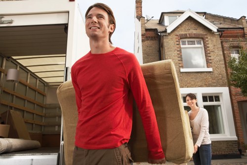 Local movers handling a South London flat removal with narrow hallway access