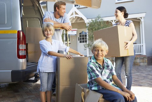 Careful unloading of household items during a Tooting removal service